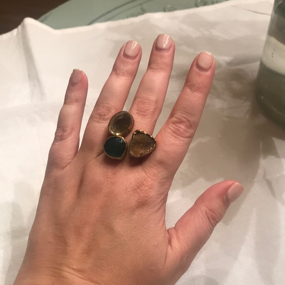 Green and neutral stone ring.